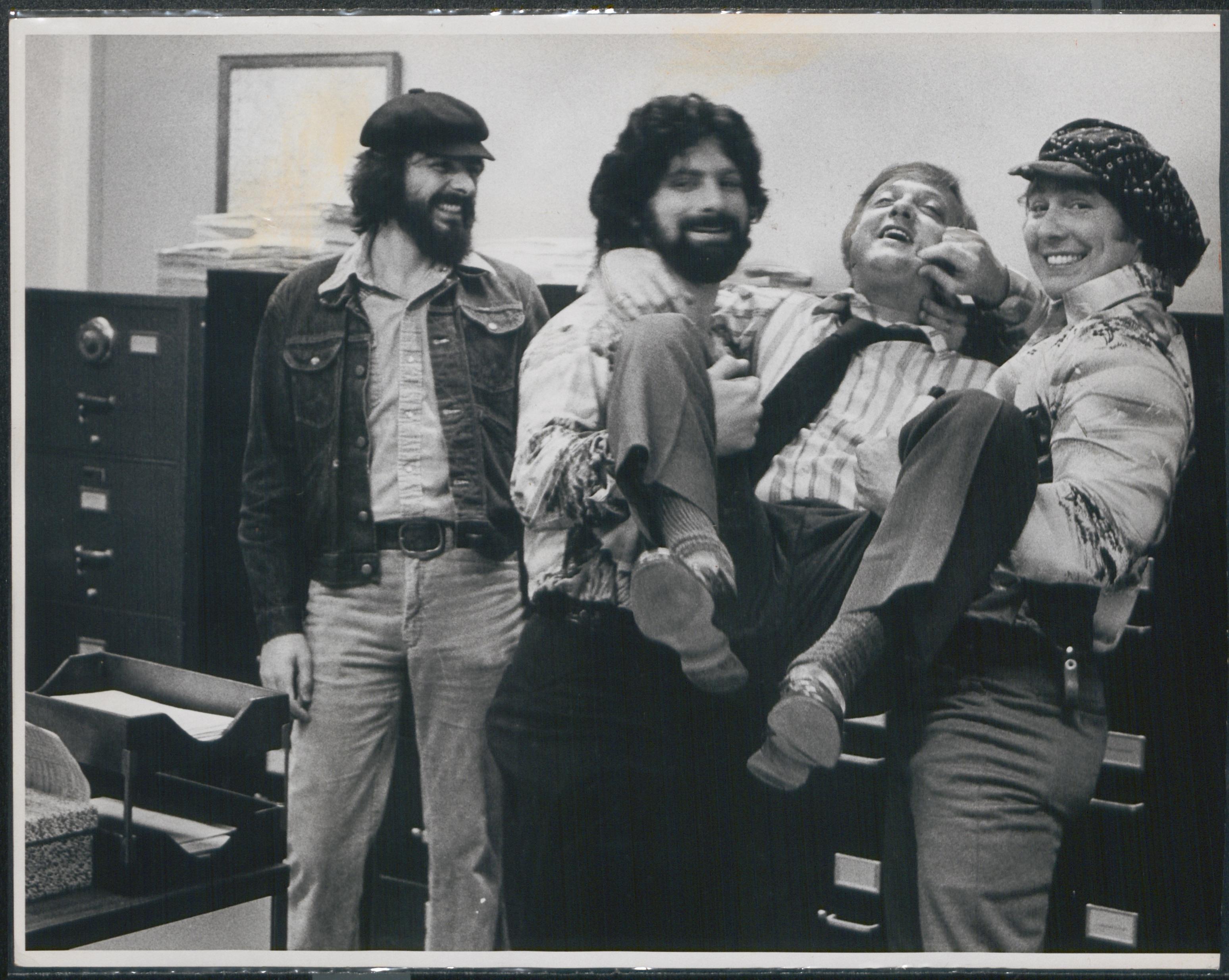 "Tony Bonzano" and "Bohanna Lafontaine" roughhouse with Lt. Robert Arscott "Tony Bonzano" and "Bohanna Lafontaine" roughhouse with Lt. Robert Arscott